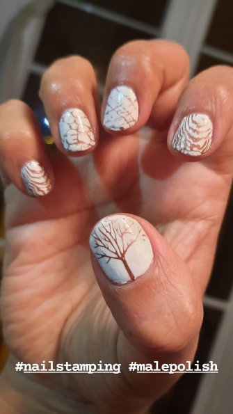 Trees made with brown nail stamping over a white base