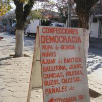A sign in democracy street